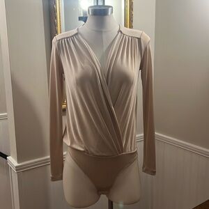 Free People tan bodysuit. XS.  Gently worn.